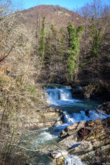 Waterfall on Zhane river on sunny winter day. Krasnodar Krai, Gelendzhik, Russia