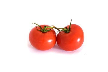 Two fresh red tomatoes isolated on a white background