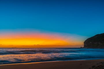 Fototapeta na wymiar Orange glow sunrise seascape