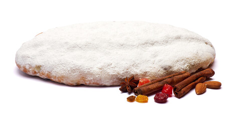 Traditional Christmas stollen cake with marzipan and dried fruit isolated on white background