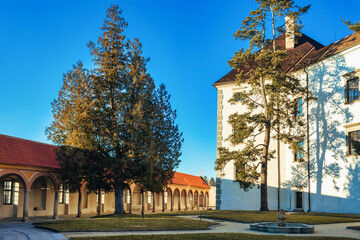 The historical castle complex in old town of Jindrichuv Hradec city. View of fountain in Rondell...