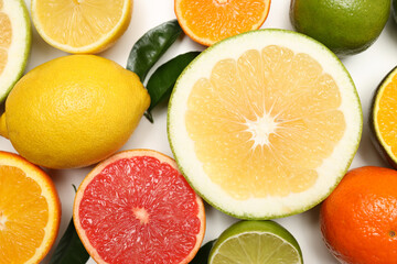 Different citrus fruits on white background, close up