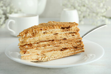 Concept of tasty dessert with honey cake, close up