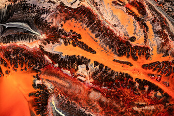 Obraz na płótnie Canvas Fluid art texture. Background with abstract paint effect. Liquid picture with dinamic lines and fractals. Mixed paints for wall art or design poster. Backdrop similar to the landscape of movement lava