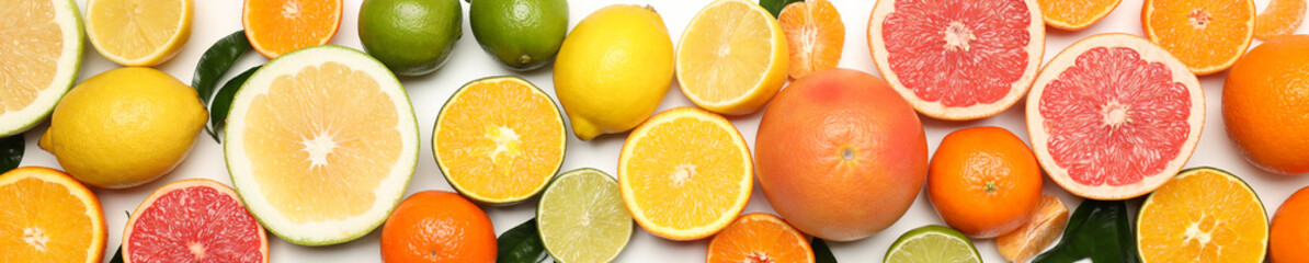 Different citrus fruits on white background, top view