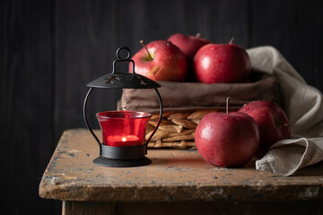 Red apples in a basket on a dark background