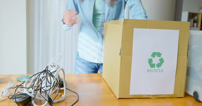 woman is recycling at home