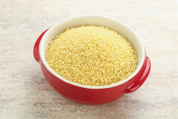 Raw couscous in the bowl
