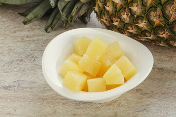 Marinated pineapple slices in the bowl