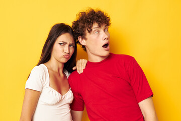 Fototapeta premium cute young couple together posing emotions close-up yellow background unaltered