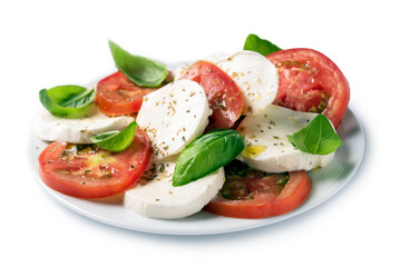 Piatto di insalata caprese fresca con mozzarella, pomodoro, olio di oliva, origano e basilico, cibo...
