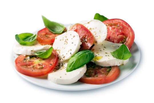 Piatto di insalata caprese fresca con mozzarella, pomodoro, olio di oliva, origano e basilico, cibo Italiano 