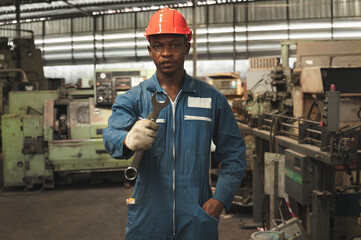 Portrait mechanic, engineer hard work with machine at factory