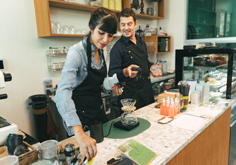 Portrait couple barista or owner coffee shop in coffee shop 