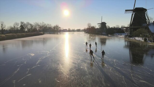 Iceskating on river the Vecht, the Netherlands 