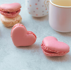 Macaron cake or heart shaped macaroons on a gray background, colorful macaroons, pastel colors. Square photo.