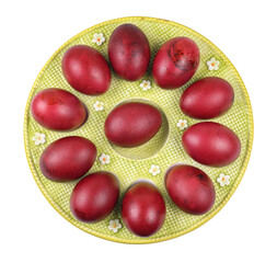 A plate of colored red Easter eggs isolated on a white background
