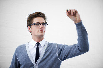 Writing your message in digital letters. A handsome young nerdy guy writing something in copyspace.