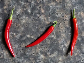 red hot chili peppers on the rusty concrete background with copy space
