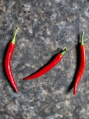 red hot chili peppers on the rusty concrete background with copy space