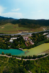 A place where two rivers of different colors meet. Aerial view panorama. Mountains. Travel and...
