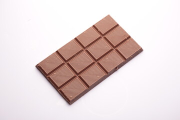 Milk chocolate bar on white background