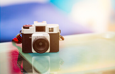 vintage camera on table with strap