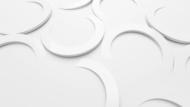 A variety of white abstract shapes are moving on a white background. 