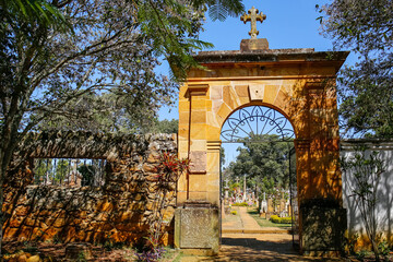 Entrance gate and stone wall of the cemetery at the Chapel of Santa Barbara, Barichara, Colombia