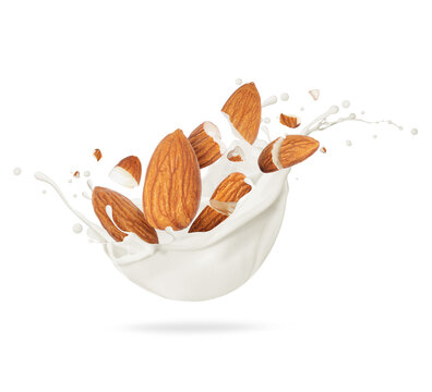 Cracked almond in milk splash close-up on white background