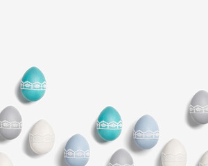 Easter eggs pastel colors green, blue, gray, beige on white background. Symbol Easter holiday, celebration food concept, dyed chicken egg trendy color and decorated lace tape. Top view