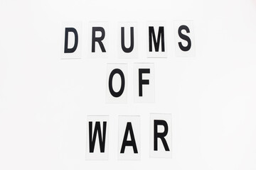 Text DRUMS OF WAR on white background. Russian invasion of Ukraine and war in Europe concept. copy space