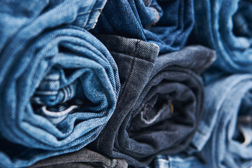 Stack of Various Shades Of Blue Jeans On White Background Denim jeans texture. Denim background texture for design. Canvas denim texture. Blue denim that can be used as background.