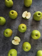 green apples on a wooden table, food pattern, flat lay, top view