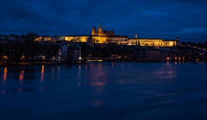 Famous Castle of Prague, Czech Republic, situated over the Vltava river after sunset with beautifully painted sky on the blue hour.