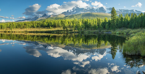 Fototapeta premium Picturesque mountain lake in the summer morning, Altai. Beautiful reflection of mountains, sky and white clouds.