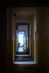  Light at the end of tunnel - long dark corridor of abandoned military barracks