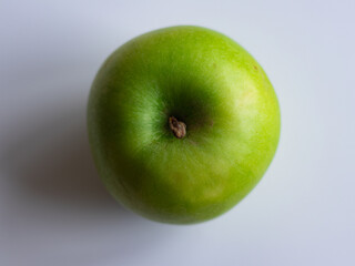 green apple on a blue background