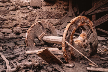 old rusty ox car wheels buried in the mud