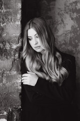 Fototapeta premium Beautiful girl, blonde, in a black suit, office style, work clothes, no war, Ukraine