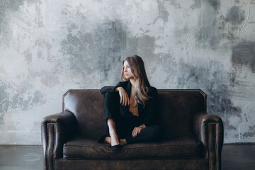 Obraz premium Beautiful girl, blonde, in a black suit, office style, work clothes, no war, Ukraine