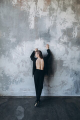 Obraz na płótnie Canvas Beautiful girl, blonde, in a black suit, office style, work clothes, no war, Ukraine