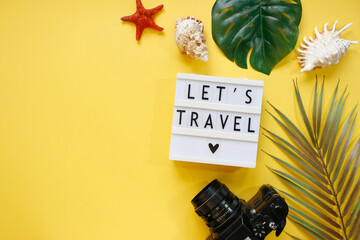 Summer holiday background, travel concept with camera on color background. Flat lay. Copy space.