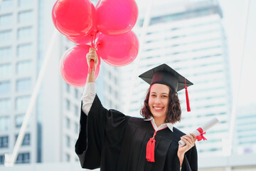 graduation day university woman and family, girl hold diploma and balloon congratulations on the...