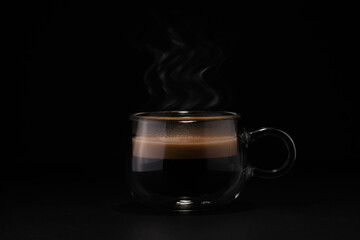 Cup of coffee, black background. Glass cups of coffee black background. Coffee drink in a double...