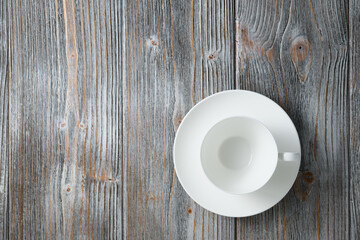White empty cappuccino cup flat lay wooden background. Empty coffee cup on wooden gray wood background flat lay.