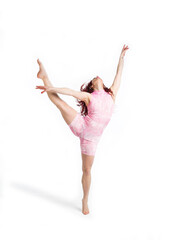 Fototapeta premium young woman dancer doing dance exercises on a white background
