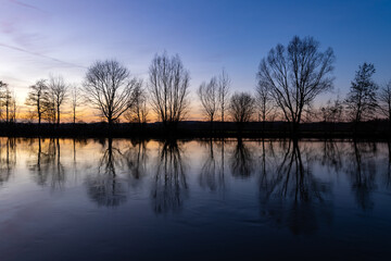Winter panorama at Ruhr River in Sauerland Germany near Schwerte. Colorful blue hour evening sunset...