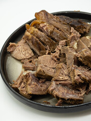 A bowl of sliced braised beef