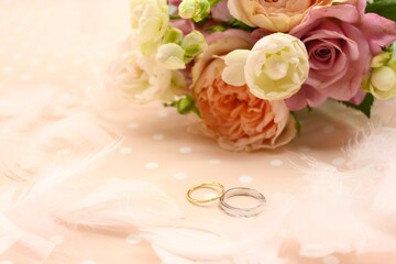 wedding rings and bouquet